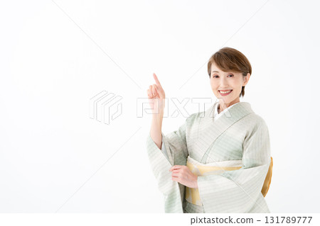 Woman in kimono pointing Woman in kimono pointing 131789777