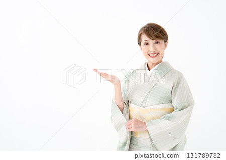 Woman in kimono, waving her hands Woman in kimono, waving her hands 131789782