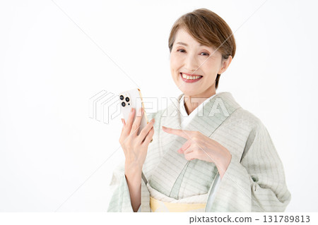 Woman holding a smartphone Woman holding a smartphone 131789813