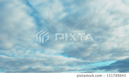 A Serene Sky painted with Fluffy Clouds and stunning Blue Hues thats truly captivating 131789843