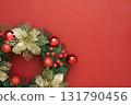 Christmas Wreath with Gold Accents on Red Background 131790456