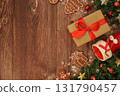 Christmas gift box and smartphone on wooden table 131790457