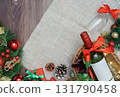 Christmas background with wine, gifts, and festive decorations 131790458