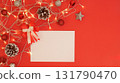 Blank Christmas card on red background with festive decorations 131790470