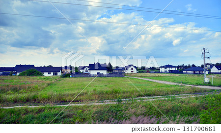 Warsaw, Poland. 15 July 2025. Suburban landscapes from a train window. Warsaw, Poland. 15 July 2025. Suburban landscapes from a train window. 131790681