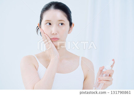 A young woman doing skin care 131790861