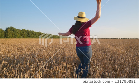 Joyful Moments Captured in a Beautiful Golden Field Under a Vibrant Sky at Sunset Joyful Moments Captured in a Beautiful Golden Field Under a Vibrant Sky at Sunset 131790881