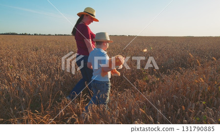 A Loving Mother and Her Cherished Child Enjoying a Beautiful Day in the Open Field 131790885