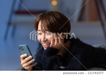 Woman smartphone winter 131791077