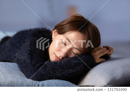 Woman napping winter Woman napping winter 131791090