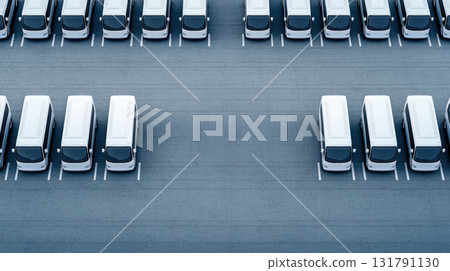 Parked white vans in spacious parking lot, organized and waiting 131791130