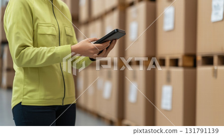 Efficient hands using handheld scanner in warehouse setting Efficient hands using handheld scanner in warehouse setting 131791139