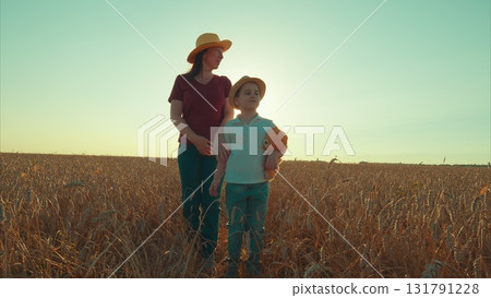 Joyful and unforgettable Moments in a Bright Sunlit Field with Loving Mother and Child 131791228