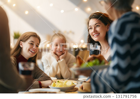 Family celebrating Thanksgiving Day Family celebrating Thanksgiving Day 131791756