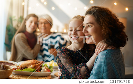 Family celebrating Thanksgiving Day 131791758