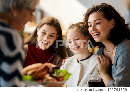 Family celebrating Thanksgiving Day 131791759