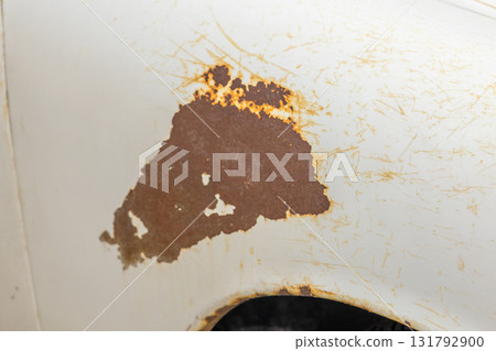 Rust and scratches on a car Rusty iron plate of an old car Rust and scratches on a car Rusty iron plate of an old car 131792900