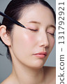 Close-up of a woman applying makeup 131792921