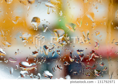 abstract background raindrops on glass. background of blurred urban landscape on a rainy day. wet window with bokeh effect 131792971