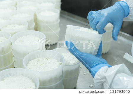 Mozzarella cheese factory. Produces handmade mozzarella with fresh milk, close up 131793940