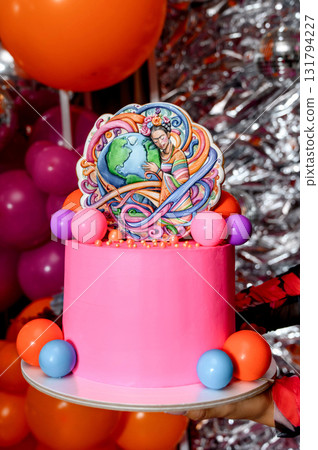 A bright pink cake with a Frida Kahlo-inspired topper 131794227