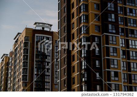 Close-up of the facades of two modern apartment buildings with glazing. 131794362