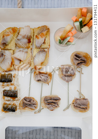 An assortment of mini sandwiches and canapes for a buffet 131794411