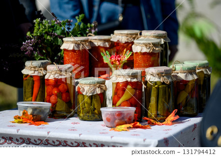 Close-up of autumn preparations and preserves in glass jars. 131794412