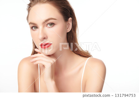 A beautiful young woman with clean, fresh skin against a white background. Skincare, facial treatment, cosmetology, beauty, and spa. An elegant portrait of an woman. A beautiful young woman with clean, fresh skin against a white background. Skincare, facial treatment, cosmetology, beauty, and spa. An elegant portrait of an woman. 131794753
