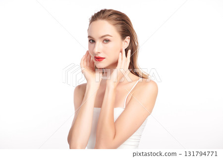 A beautiful young woman with clean, fresh skin against a white background. Skincare, facial treatment, cosmetology, beauty, and spa. An elegant portrait of an woman. A beautiful young woman with clean, fresh skin against a white background. Skincare, facial treatment, cosmetology, beauty, and spa. An elegant portrait of an woman. 131794771