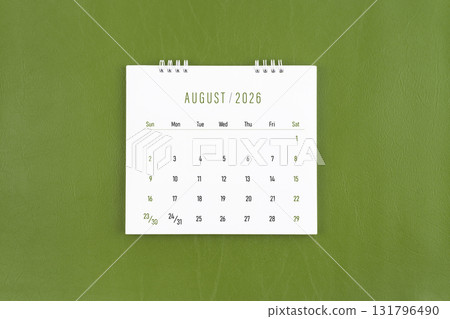 August 2026 Monthly desk calendar on green leather background. Flat lay. August 2026 Monthly desk calendar on green leather background. Flat lay. 131796490