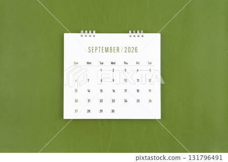 September 2026 Monthly desk calendar on green leather background. Flat lay. September 2026 Monthly desk calendar on green leather background. Flat lay. 131796491