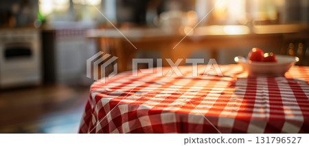 Red and white checkered tablecloth on wooden table in cozy cafe interior 131796527