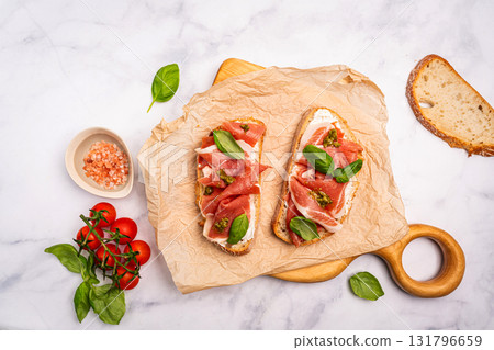 Grilled toast with jamon or prosciutto 131796659
