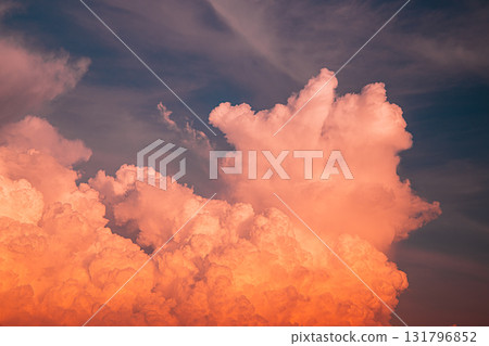 Brightly Colored Sunset Clouds Illuminating the Evening Sky 131796852