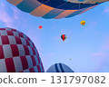 Hot air balloons ascend into the sky during a sunrise in Turkey 131797082