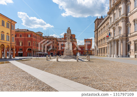 Modena Italy Piazza Roma with statue and historic buildings on a sunny day 131797109