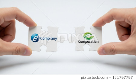 Two hands joining puzzle pieces with company logos. Business merger, acquisition, and partnership concept. Corporate synergy and collaboration 131797797