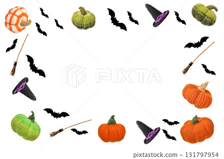 Abstract white background for Halloween holiday decorations in the form of a knitted witch's hat, a broom, black bats and an orange green knitted pumpkin flying in the air. Halloween concept. 131797954