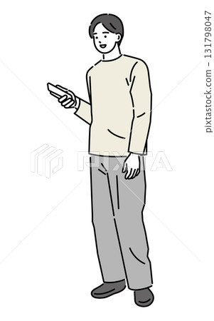 A man holding and operating a mobile phone A man holding and operating a mobile phone 131798047