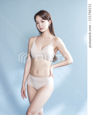 Woman is wearing a white bikini top and white underwear Woman is wearing a white bikini top and white underwear 131798151