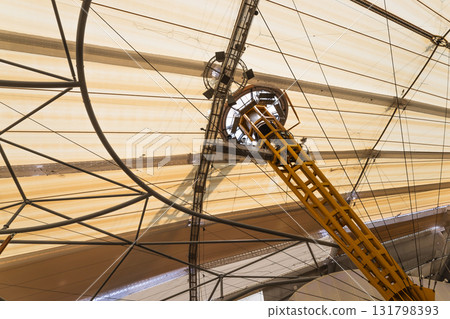 Radial cable and mast detail of a tensile membrane roof on a modern stadium canopy 131798393