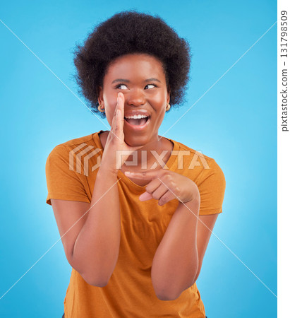 Black woman, drama and secret gossip in studio, sharing exciting confidential news on blue background. Deal announcement, whisper and happy African girl with afro, discussion isolated in privacy. Black woman, drama and secret gossip in studio, sharing exciting confidential news on blue background. Deal announcement, whisper and happy African girl with afro, discussion isolated in privacy. 131798509