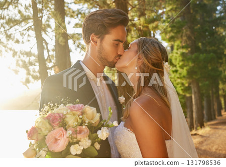 Wedding, married and couple kiss in park, forest and nature for celebration of love, care and marriage commitment. Bride, groom and kissing in garden for romance, bridal event and celebrate ceremony Wedding, married and couple kiss in park, forest and nature for celebration of love, care and marriage commitment. Bride, groom and kissing in garden for romance, bridal event and celebrate ceremony 131798536