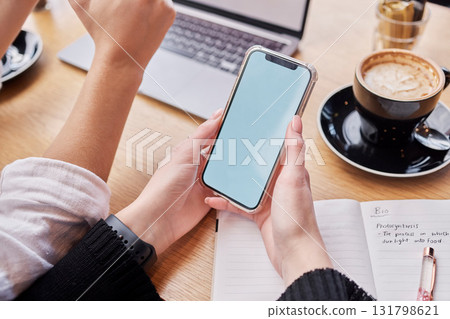Search, phone screen and mockup with hands of woman in coffee shop for social media, technology and research. Digital, website and networking app with student in cafe for remote study and contact Search, phone screen and mockup with hands of woman in coffee shop for social media, technology and research. Digital, website and networking app with student in cafe for remote study and contact 131798621