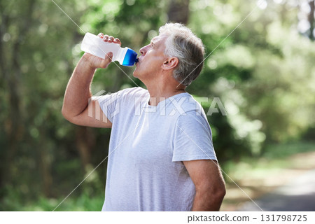 Man, exercise and outdoor drinking water for a run, workout and training for fitness. Senior male person with bottle for hydration, cardio health and wellness while running in nature and retirement 131798725
