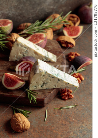 Blue cheese with fresh figs, rosemary, and walnuts. Blue cheese with fresh figs, rosemary, and walnuts. 131798776