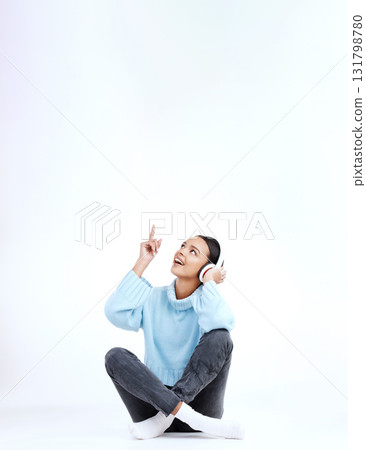 Studio music, relax and woman point at radio sales promotion, advertising space or audio podcast mockup. Marketing commercial, headphones deal and sound streaming female listening on white background Studio music, relax and woman point at radio sales promotion, advertising space or audio podcast mockup. Marketing commercial, headphones deal and sound streaming female listening on white background 131798780