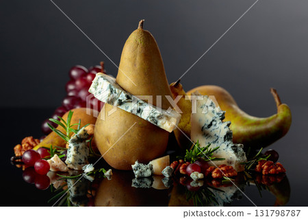 Blue cheese with pear, walnuts, red grapes, and rosemary. 131798787