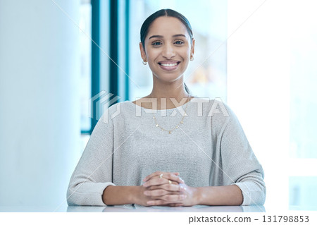 Happy, corporate and portrait of a woman at a table for a meeting, interview or management. Smile, executive and an employee sitting at a desk for administration, secretary work and human resources 131798853